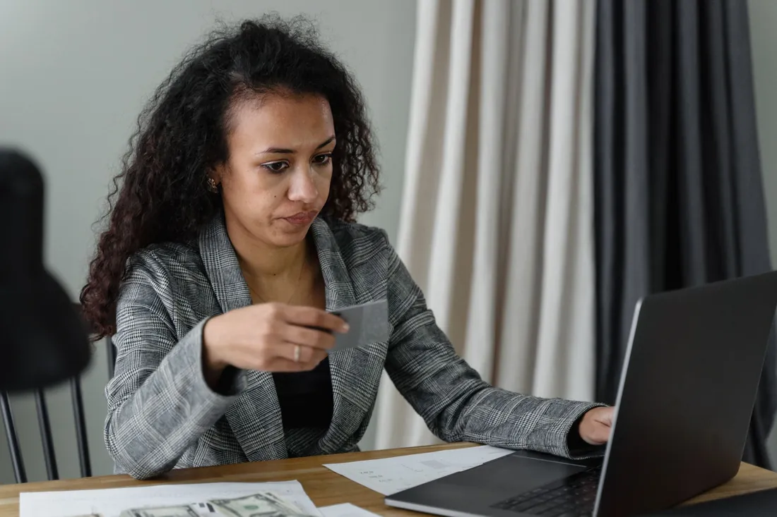Customer completing an online purchase on a laptop