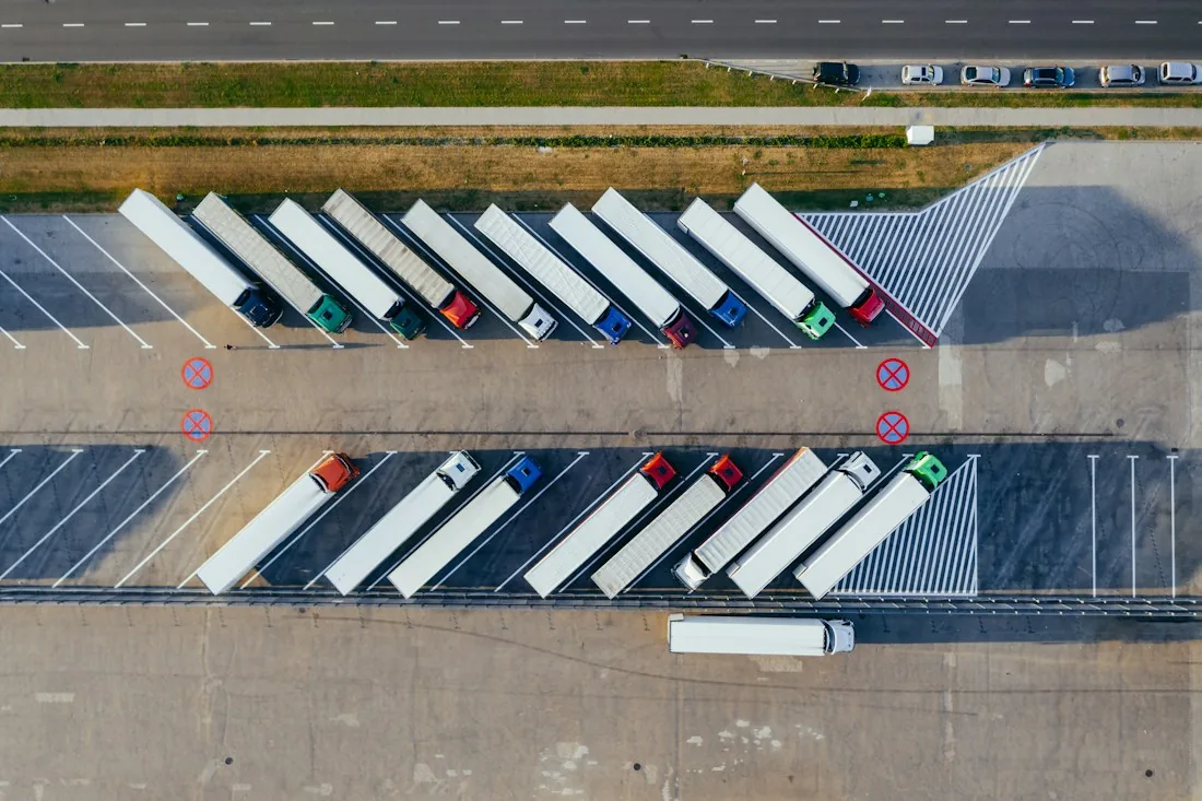 Delivery trucks parked at a depot